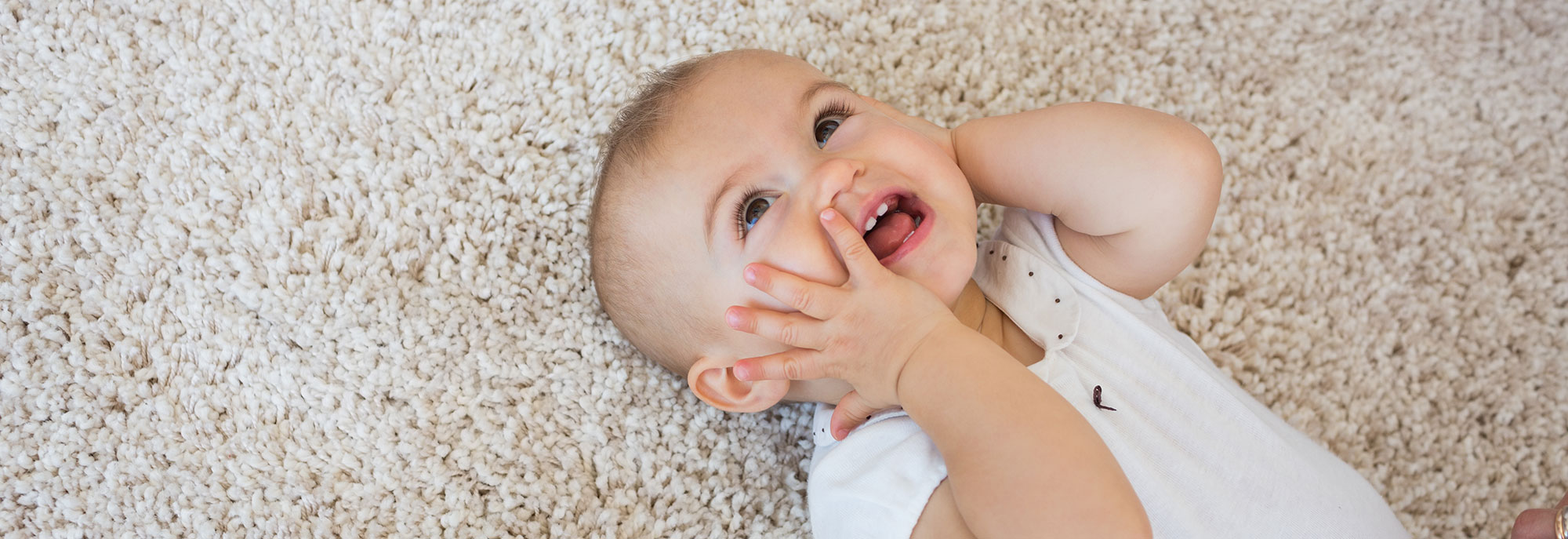 Baby Laughing on carpet